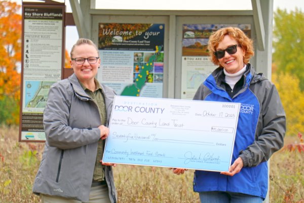 Pictured from left are Emily Wood,  Executive Director of the Door County Land Trust, and Julie Gilbert, President/CEO of Destination Door County.”
