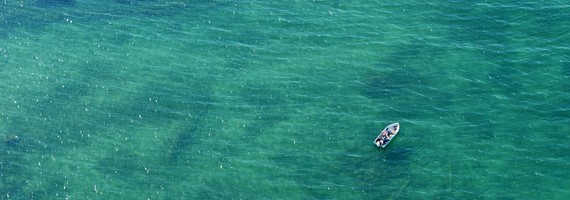A boat on the lake from above.