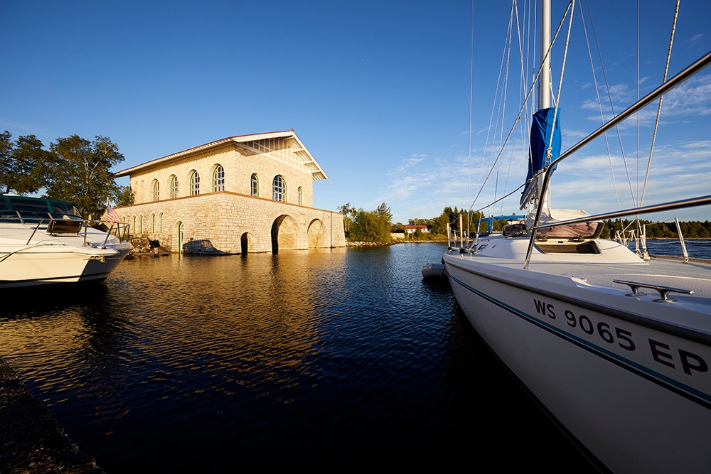 Sailboat closeup near a stone building